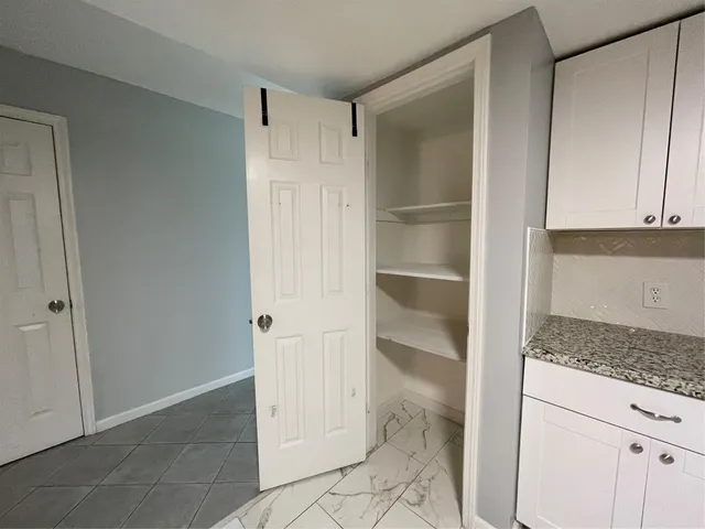 a view of an empty walk in closet