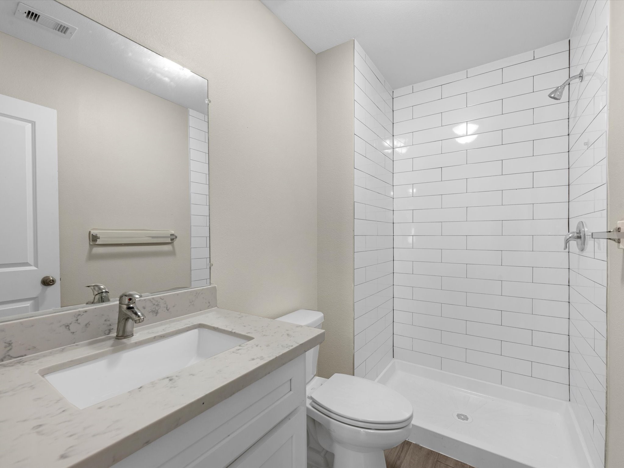 2202 Solo Street, Unit 2204 Houston, TX 77020 - Photo 17 of 21 a bathroom with a granite countertop sink toilet and shower