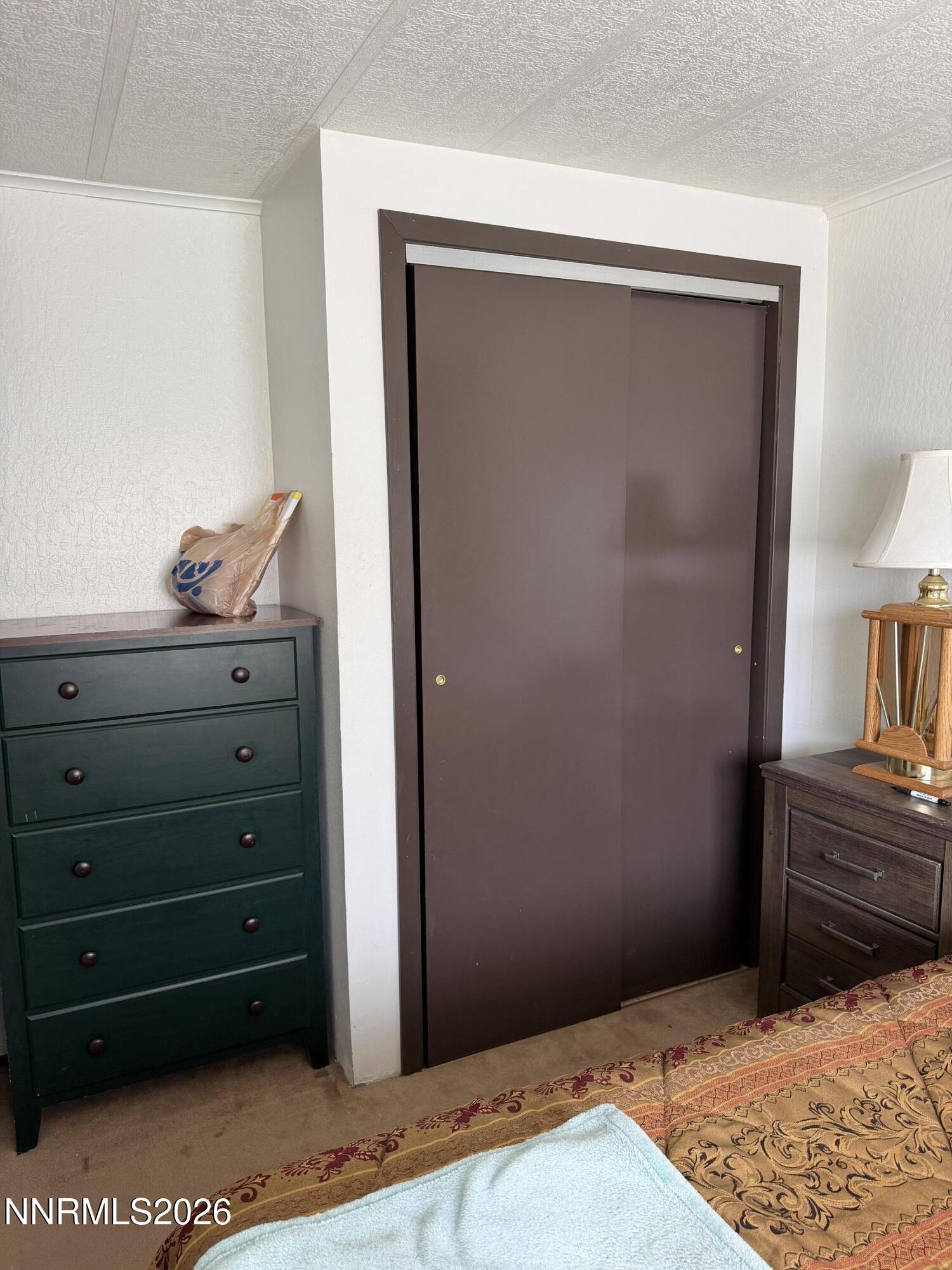 6 Ketten Road Tonopah, NV 89049 - Photo 12 of 49 a view of a dresser in the room
