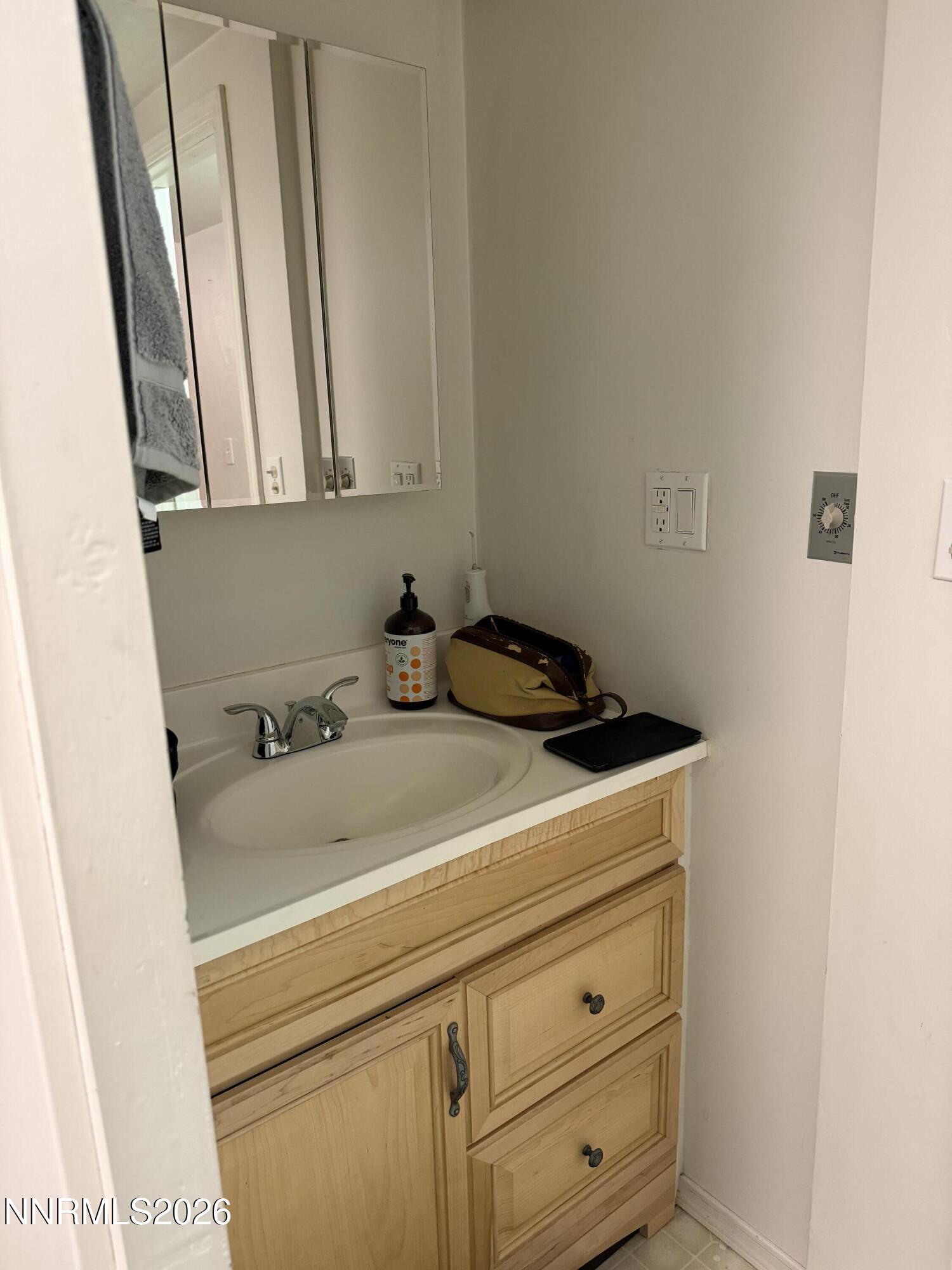 6 Ketten Road Tonopah, NV 89049 - Photo 14 of 49 a bathroom with a sink and a vanity