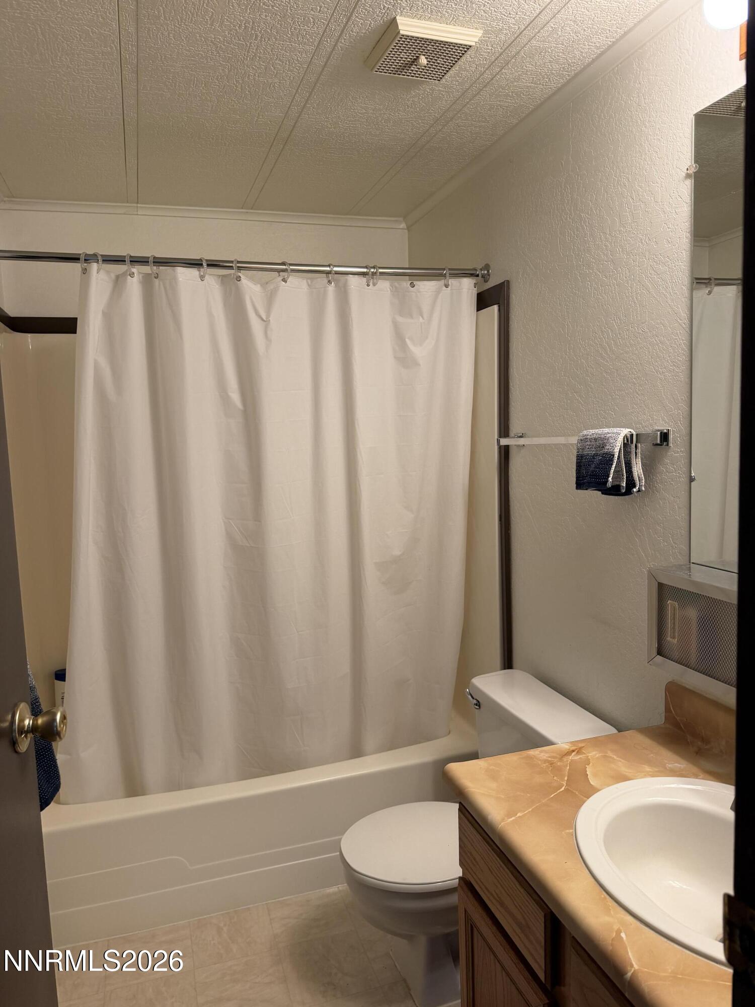 6 Ketten Road Tonopah, NV 89049 - Photo 10 of 49 a bathroom with a granite countertop sink toilet and a mirror