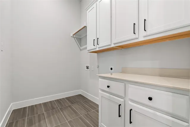 a view of white cabinets and window
