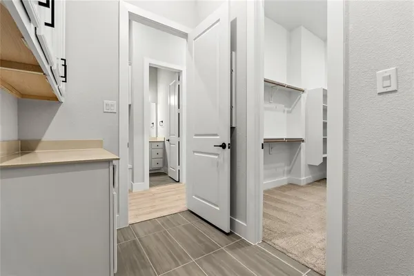 a bathroom with a shower and a sink