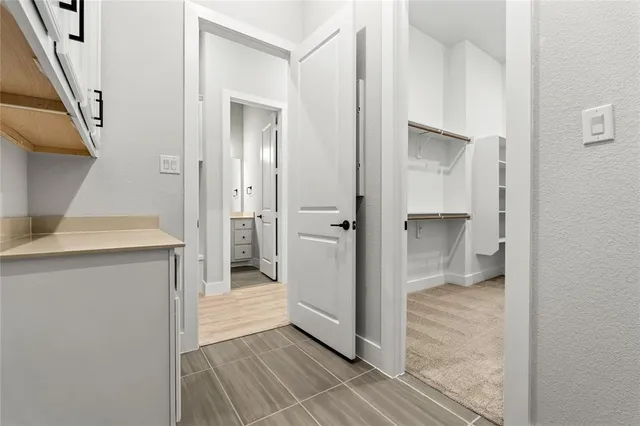 a bathroom with a shower and a sink