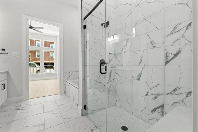 a bathroom with a glass shower door