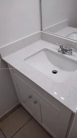a bathroom with a toilet and a sink