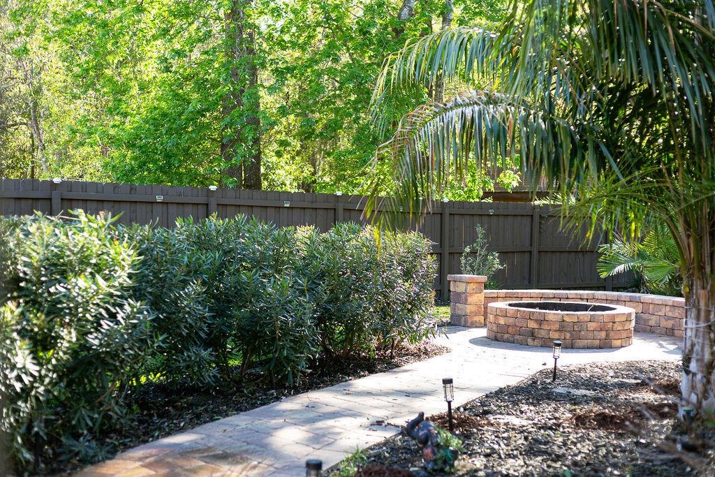 1220 Creek Bend Road Jacksonville, FL 32259 - Photo 19 of 30 a backyard of a house with outdoor seating and green space