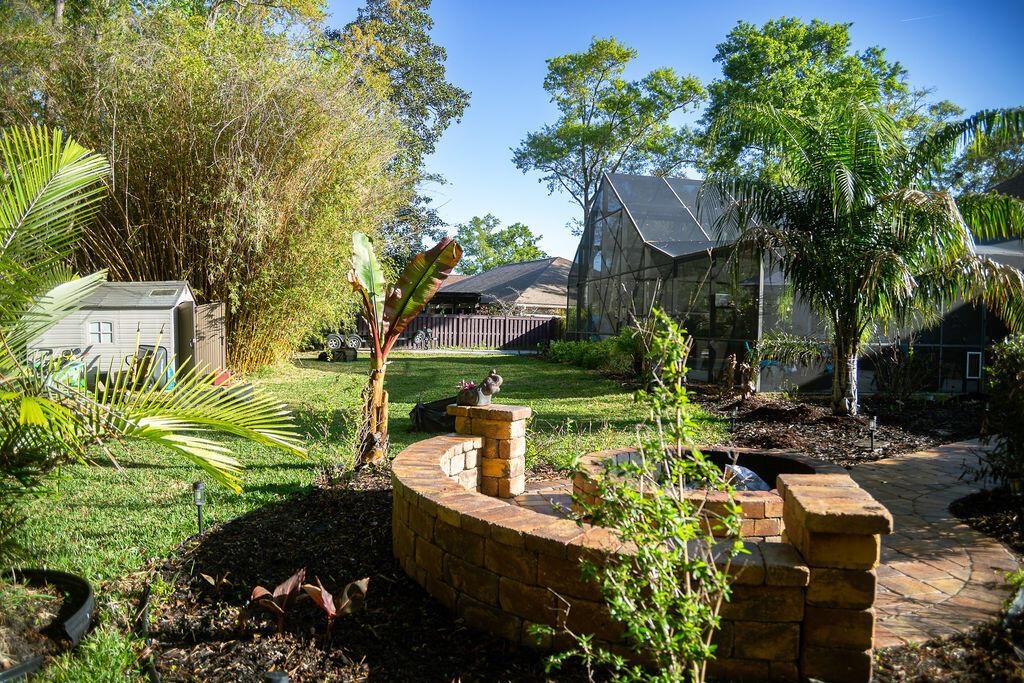 1220 Creek Bend Road Jacksonville, FL 32259 - Photo 20 of 30 a view of a house with a yard and sitting area