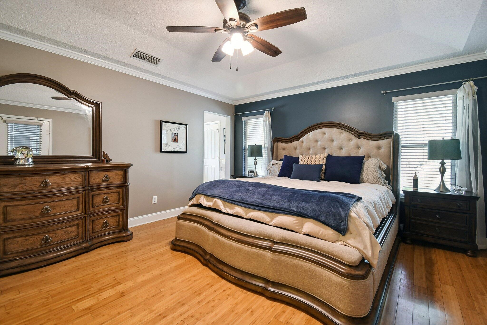 1220 Creek Bend Road Jacksonville, FL 32259 - Photo 21 of 30 Bedroom featuring light wood finished floors, crown molding, multiple windows, and a ceiling fan