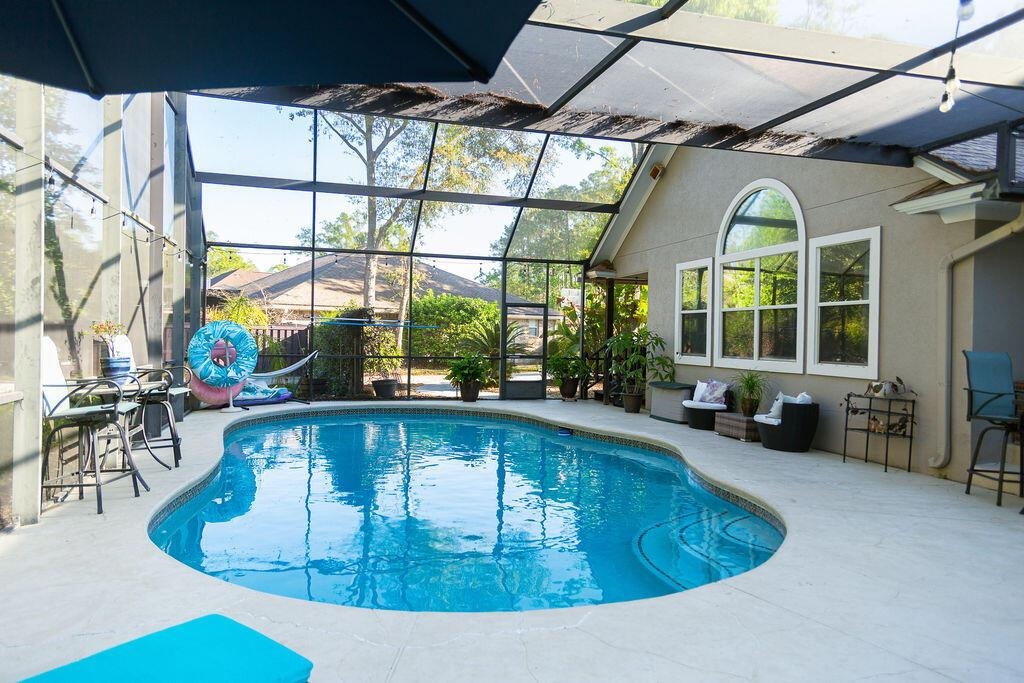 1220 Creek Bend Road Jacksonville, FL 32259 - Photo 25 of 30 a view of swimming pool with outdoor seating