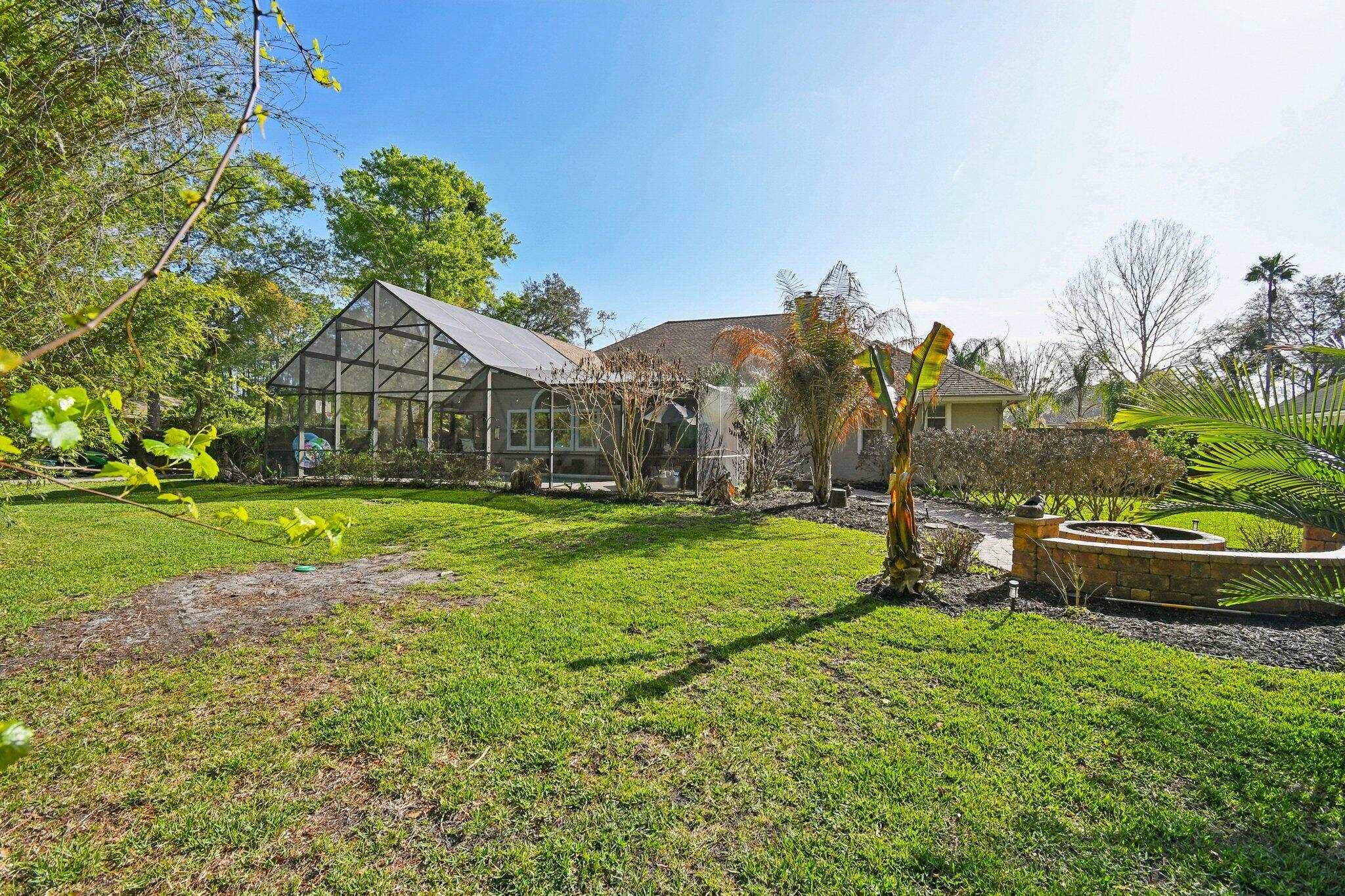 1220 Creek Bend Road Jacksonville, FL 32259 - Photo 28 of 30 a view of an house with backyard space and garden
