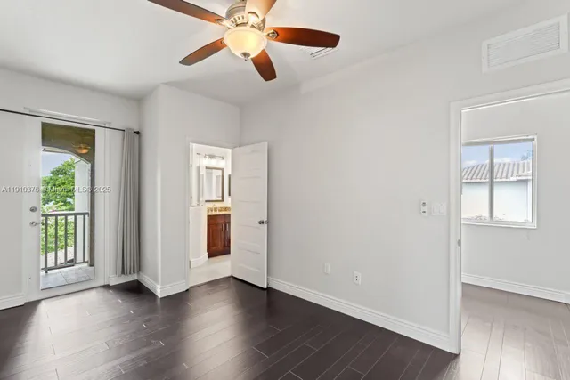 a bathroom with a granite countertop sink a mirror and a shower