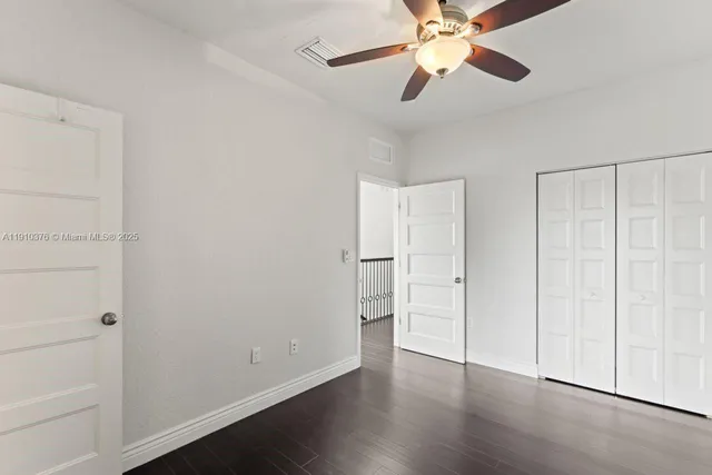 a bathroom with a granite countertop sink and shower