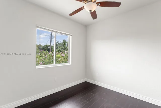 a view of a backyard with a small cabin