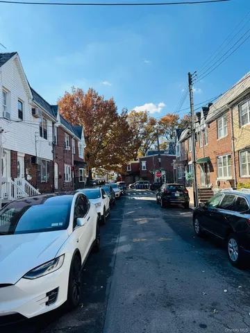 a city street lined with buildings and cars