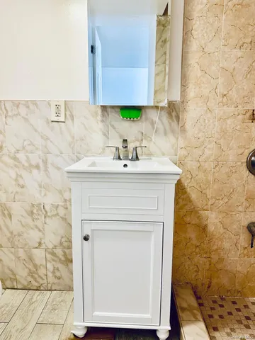a bathroom with a sink and a mirror
