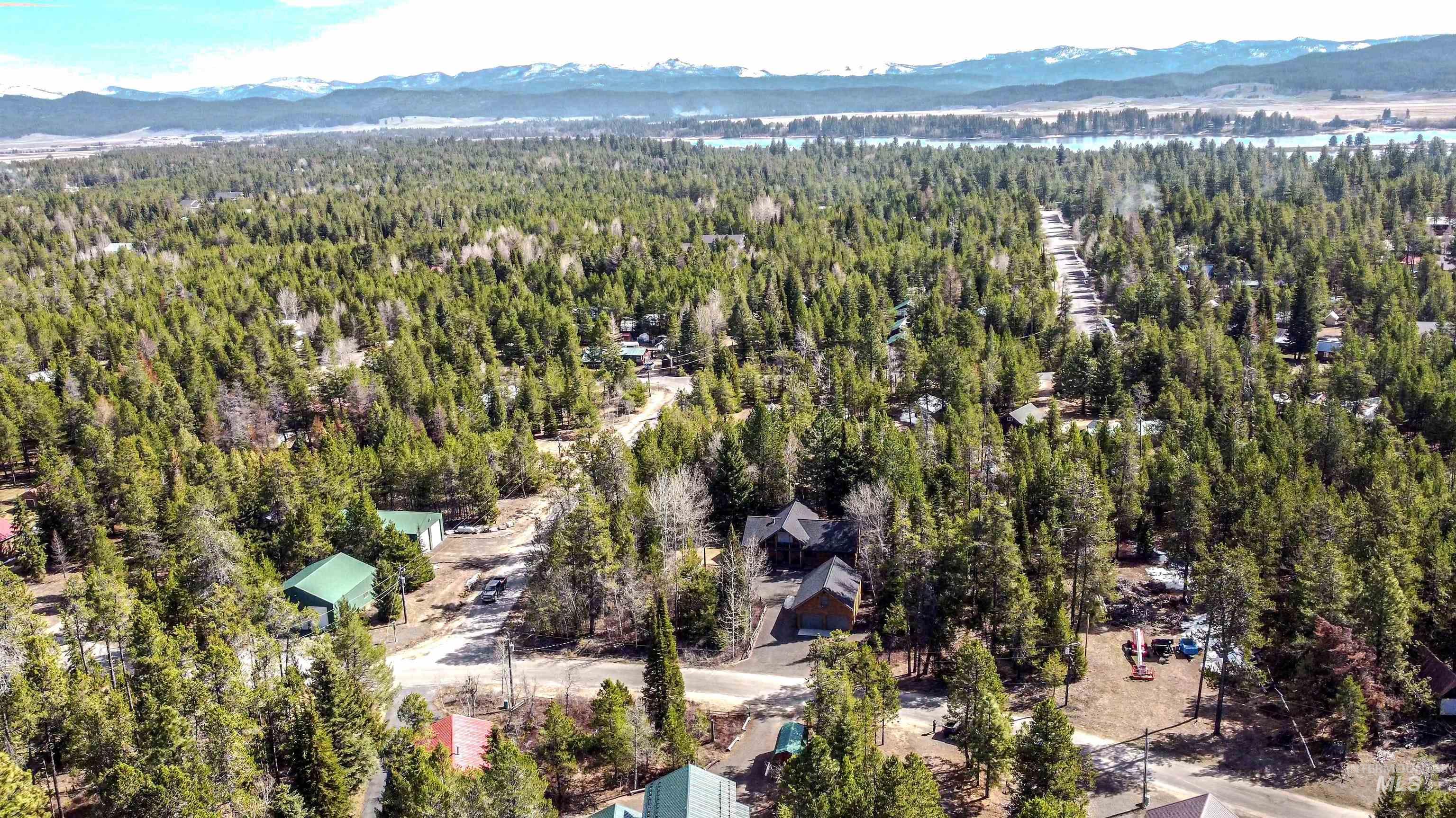 12712 Hereford Road Donnelly, ID 83615 - Photo 12 of 50 Drone / aerial view of a mountainous background and a heavily wooded area
