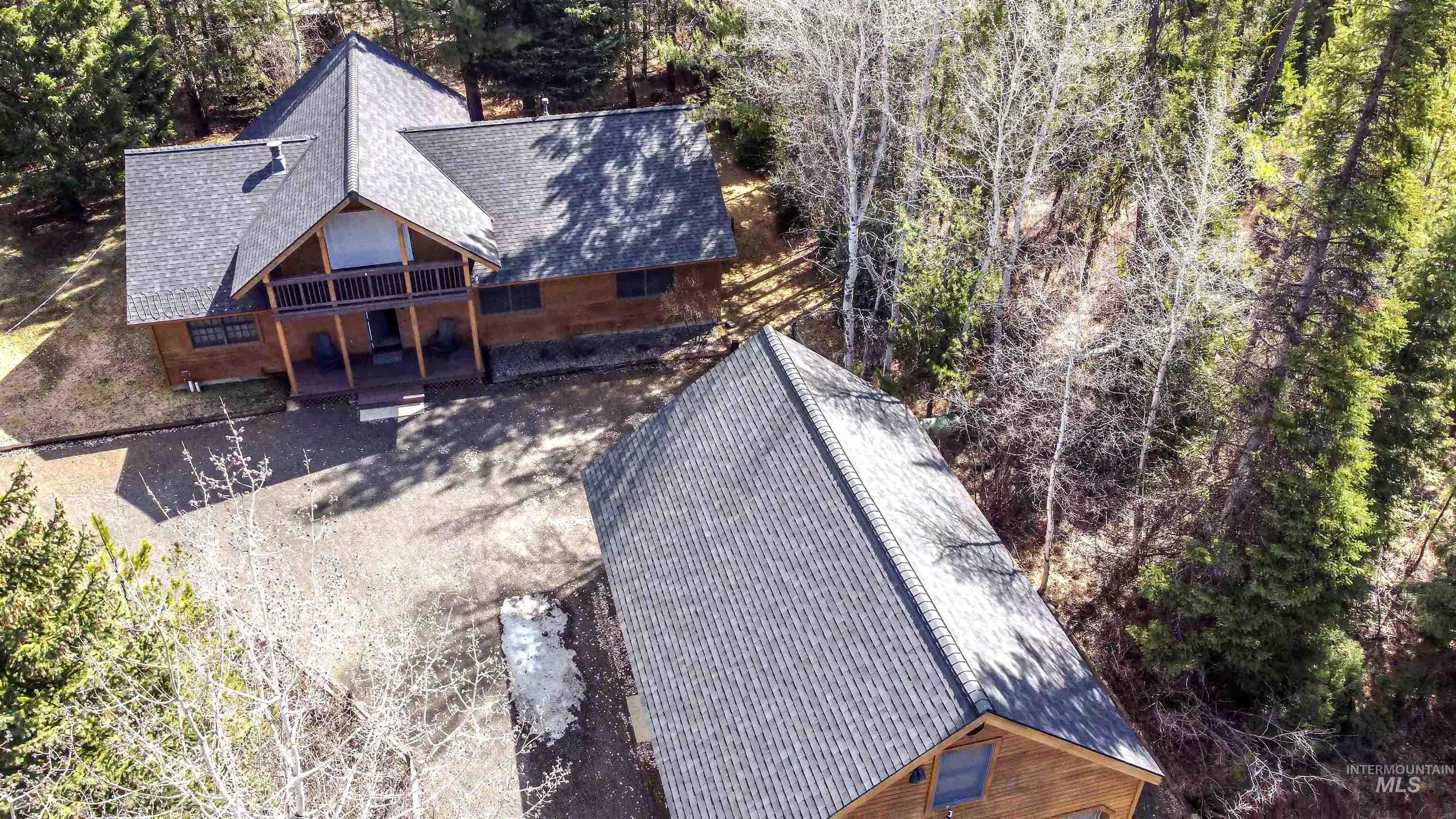 12712 Hereford Road Donnelly, ID 83615 - Photo 26 of 50 Aerial view of property and surrounding area featuring a tree filled landscape