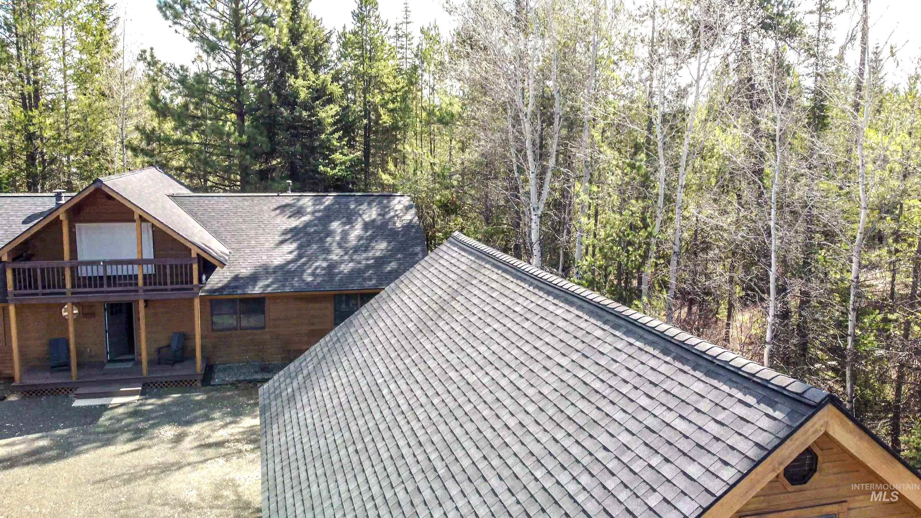 12712 Hereford Road Donnelly, ID 83615 - Photo 27 of 50 View of property exterior with a shingled roof and covered porch