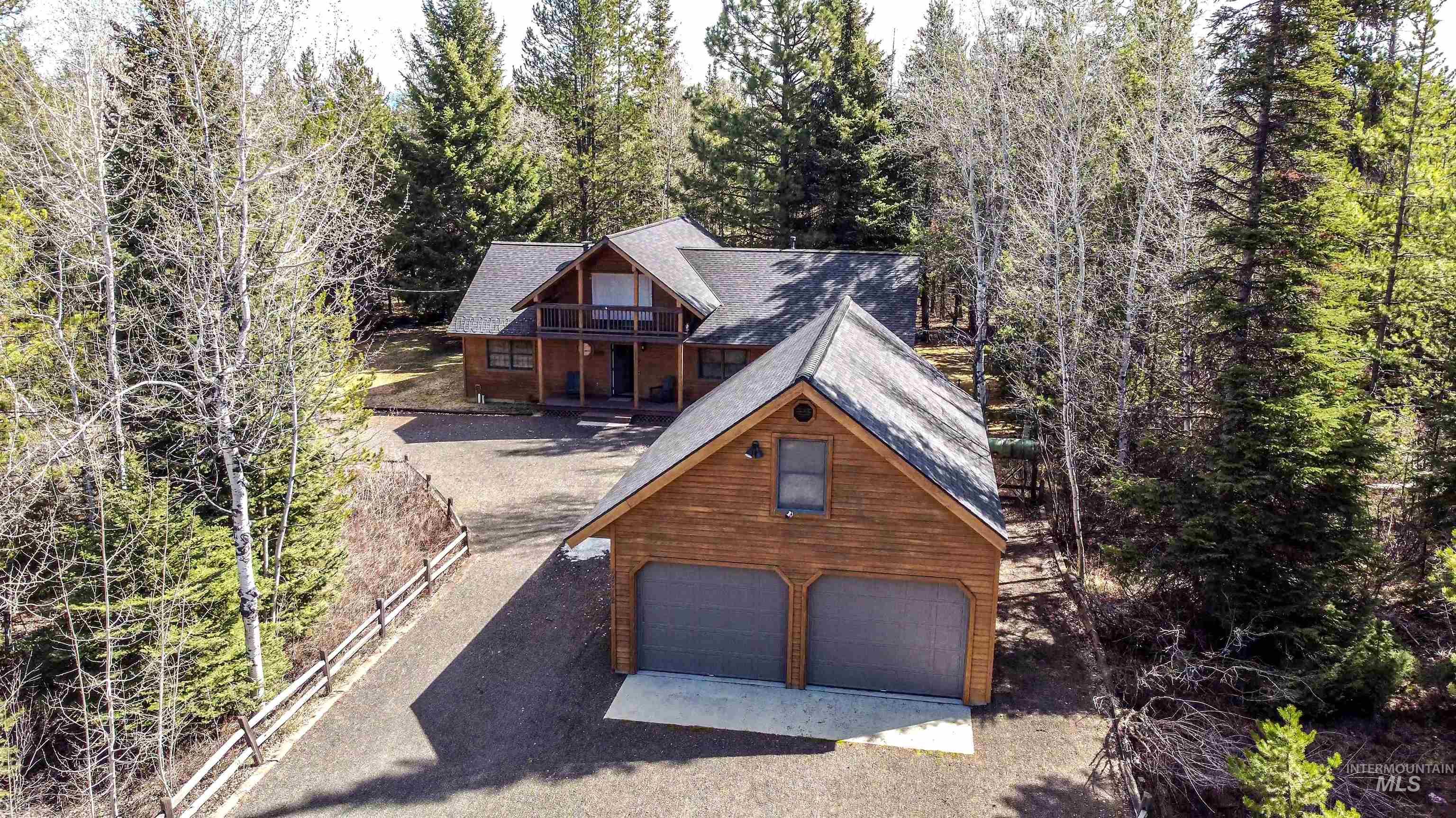 12712 Hereford Road Donnelly, ID 83615 - Photo 29 of 50 View of front facade featuring roof with shingles and a balcony