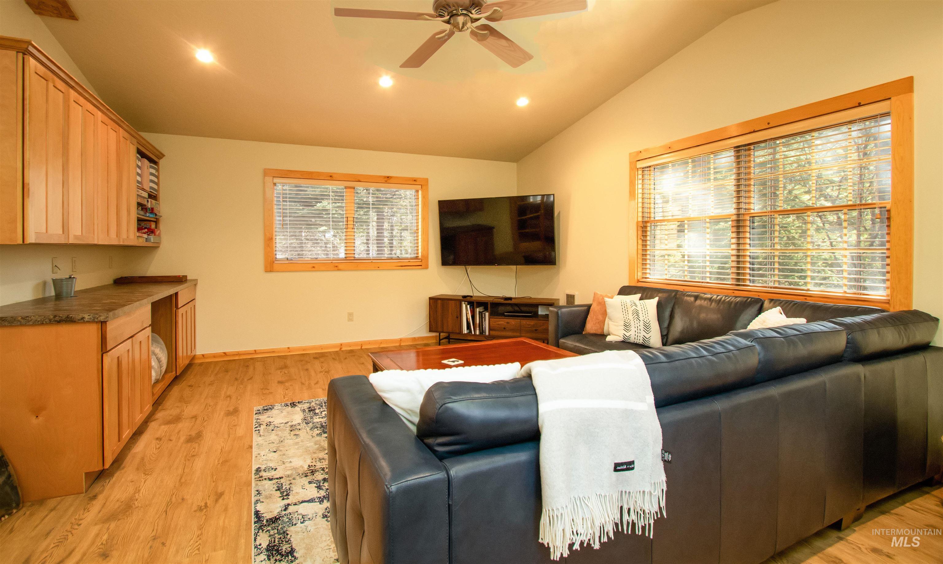 12712 Hereford Road Donnelly, ID 83615 - Photo 39 of 50 Living room with recessed lighting, lofted ceiling, ceiling fan, and light wood-style floors