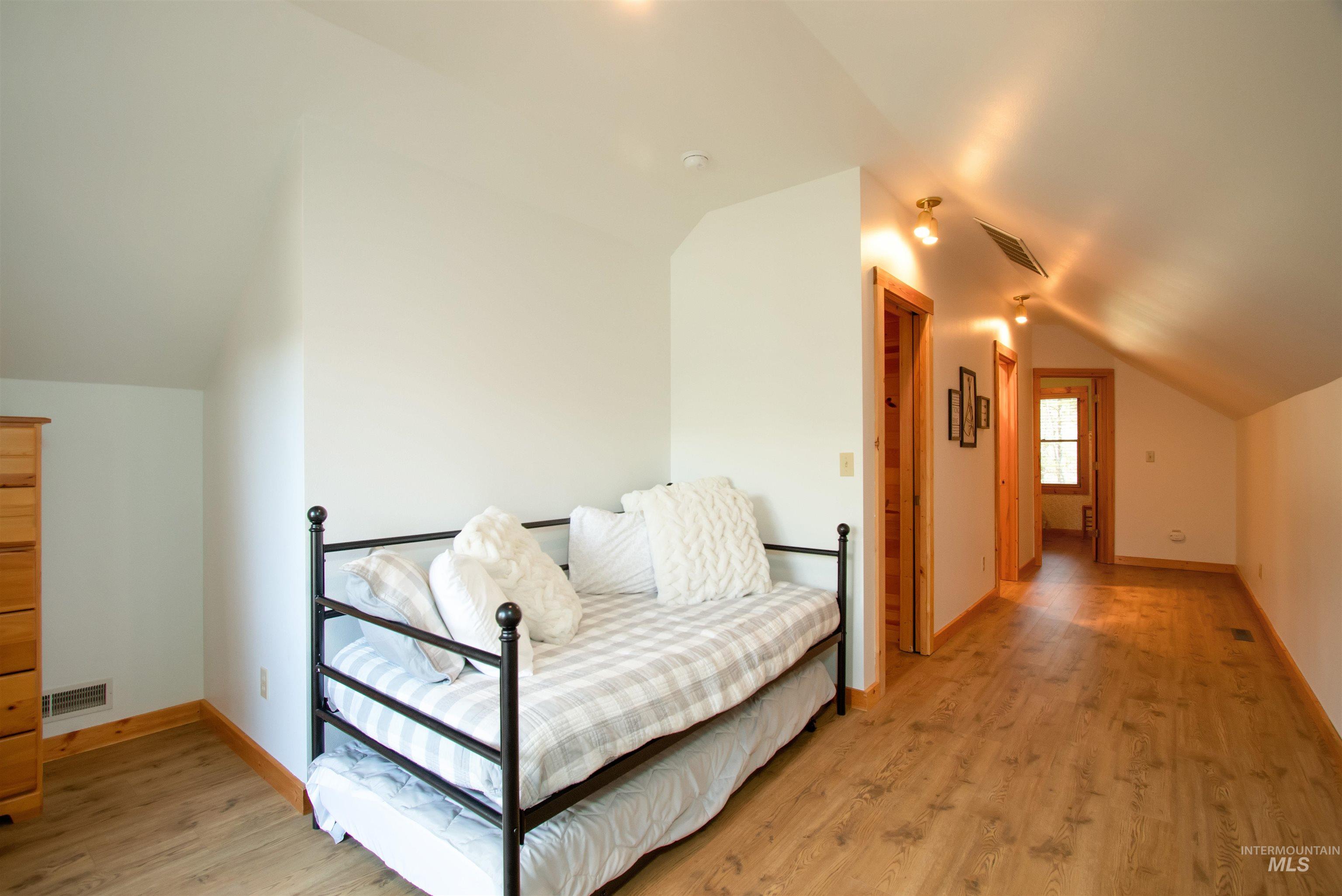 12712 Hereford Road Donnelly, ID 83615 - Photo 45 of 50 Sitting room featuring lofted ceiling and light wood-type flooring