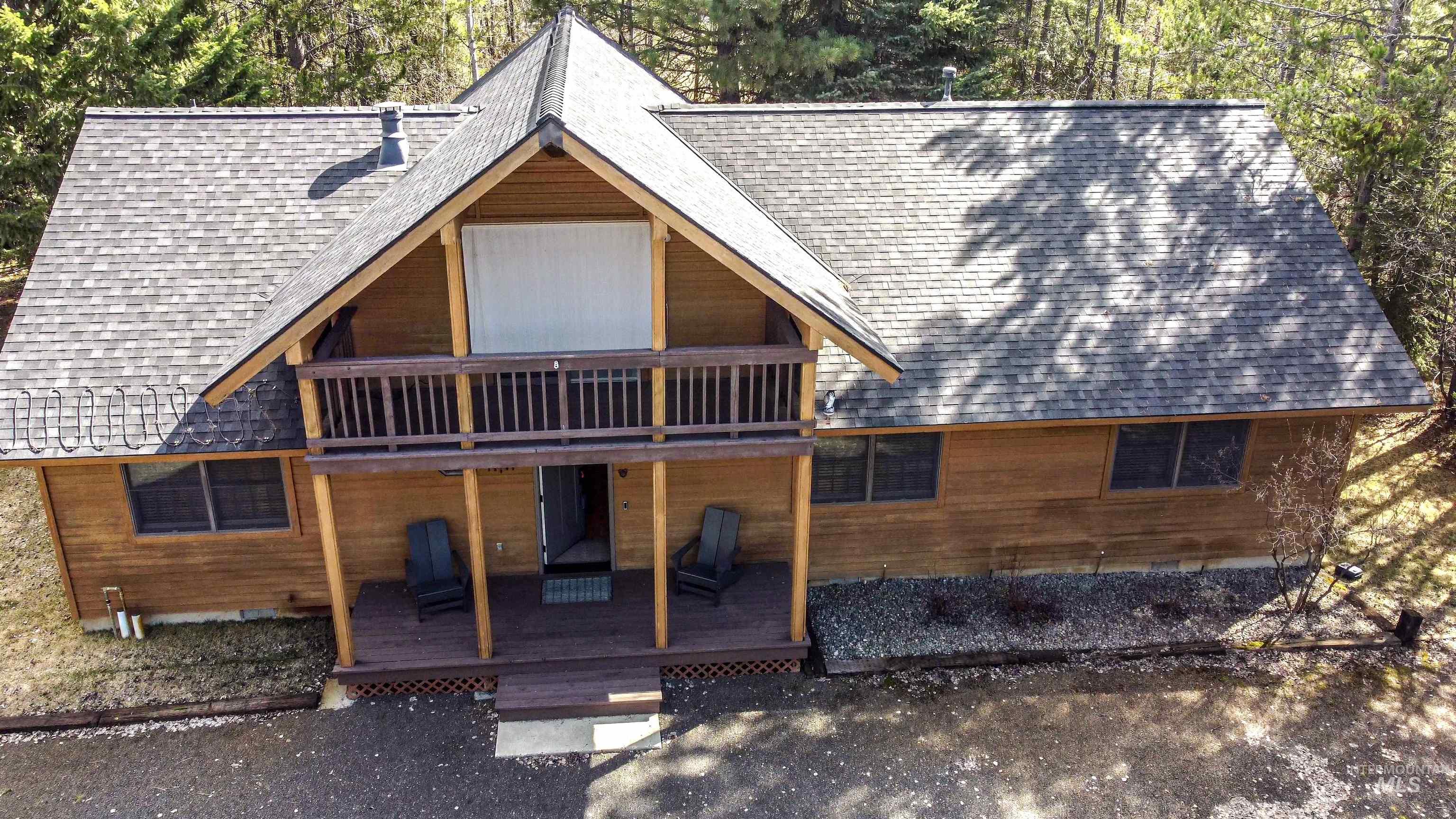 12712 Hereford Road Donnelly, ID 83615 - Photo 50 of 50 Back of house featuring roof with shingles and a deck