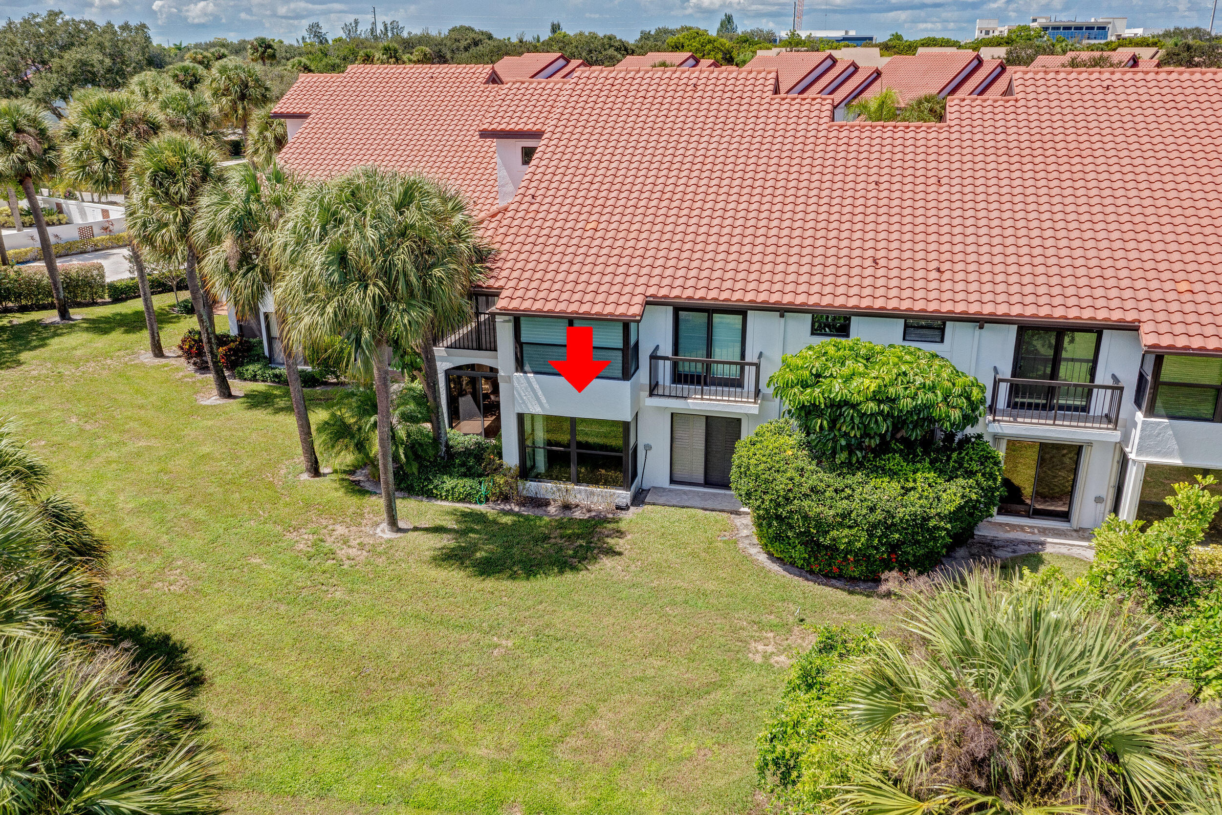 16622 Traders Crossing North, Unit 102 Jupiter, FL 33477 - Photo 17 of 19 an outdoor space with seating area