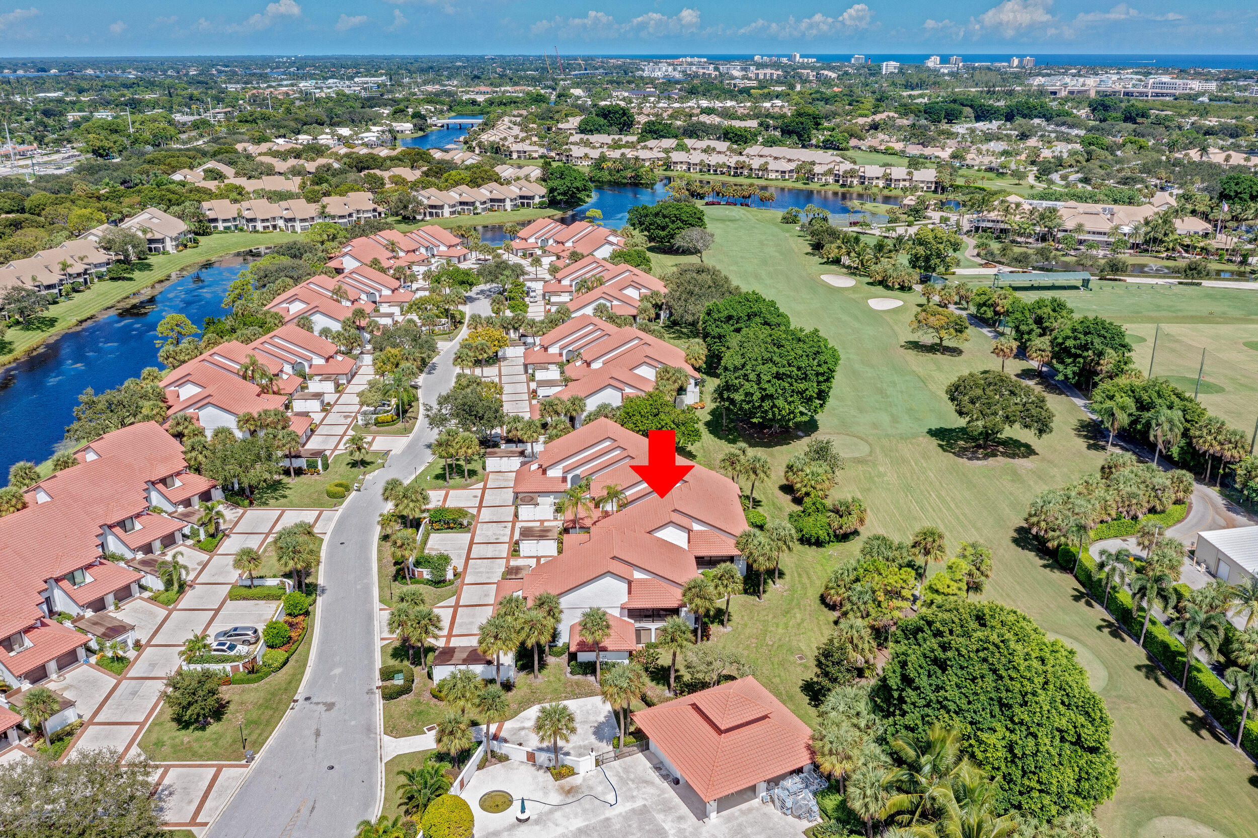 16622 Traders Crossing North, Unit 102 Jupiter, FL 33477 - Photo 19 of 19 an aerial view of residential houses with outdoor space