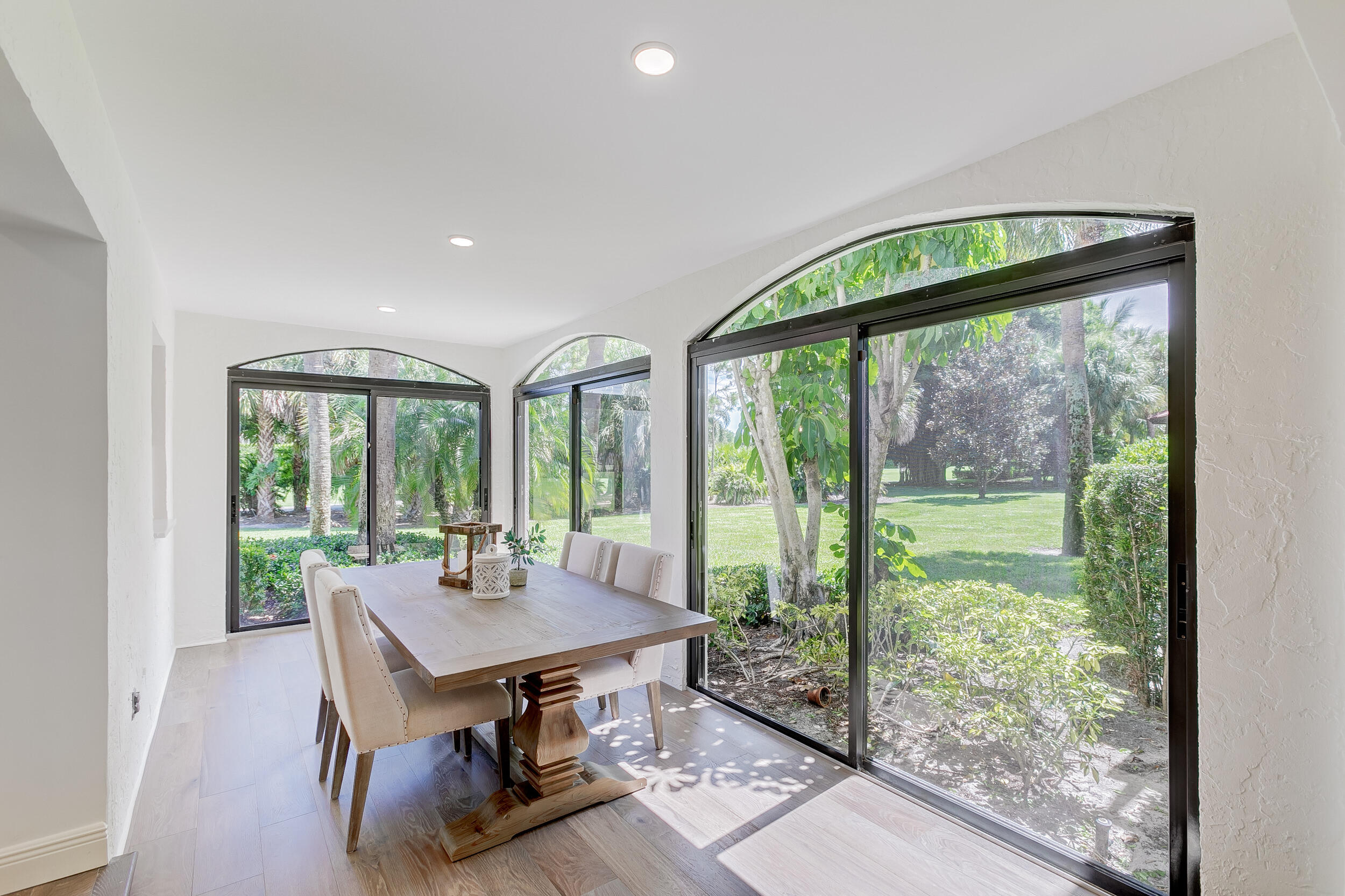 16622 Traders Crossing North, Unit 102 Jupiter, FL 33477 - Photo 6 of 19 a view of a livingroom with furniture and window