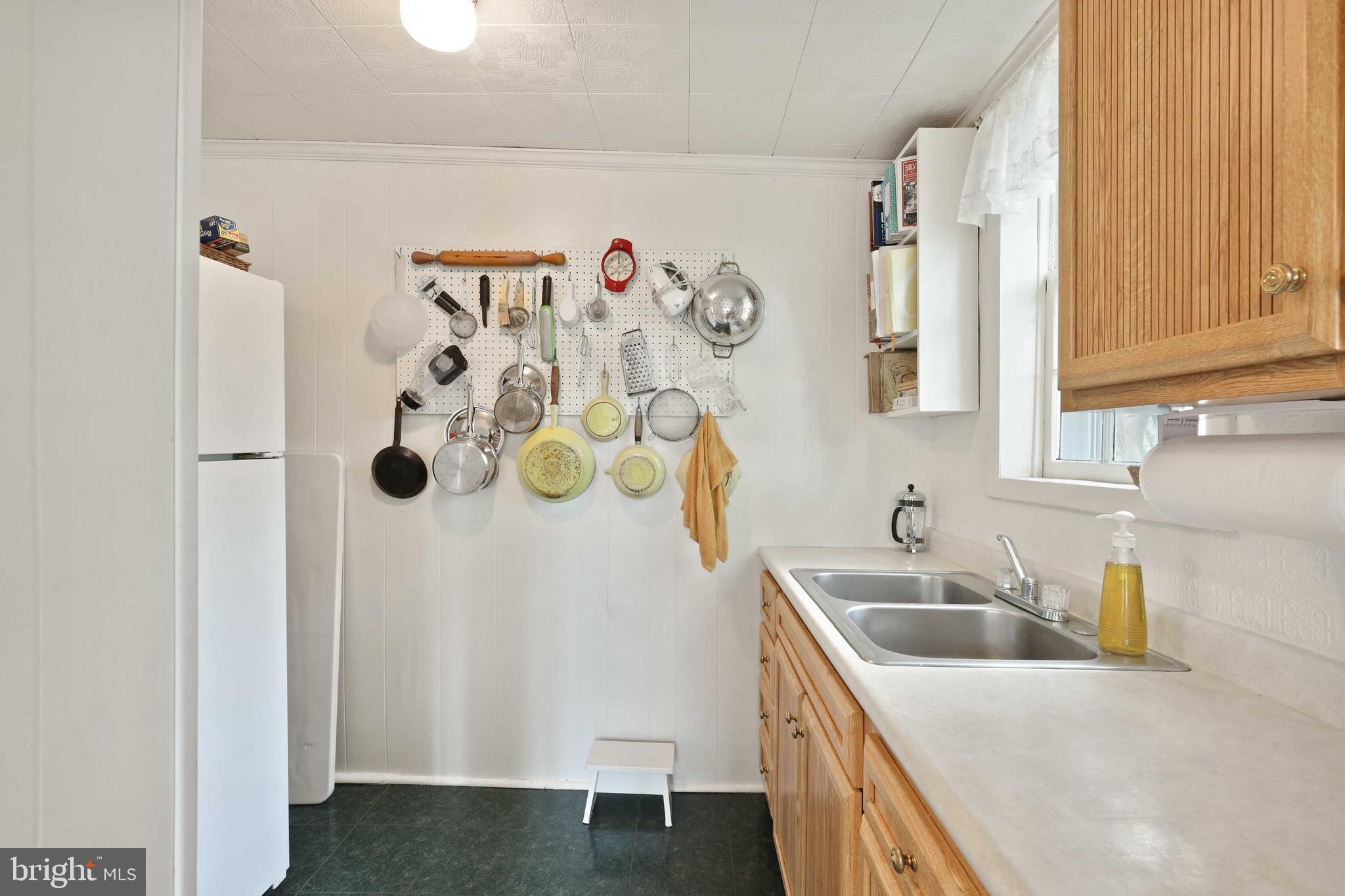4507 Wilmslow Road Baltimore, MD 21210 - Photo 21 of 59 Kitchen w/ refrigerator and rack for pots & pans