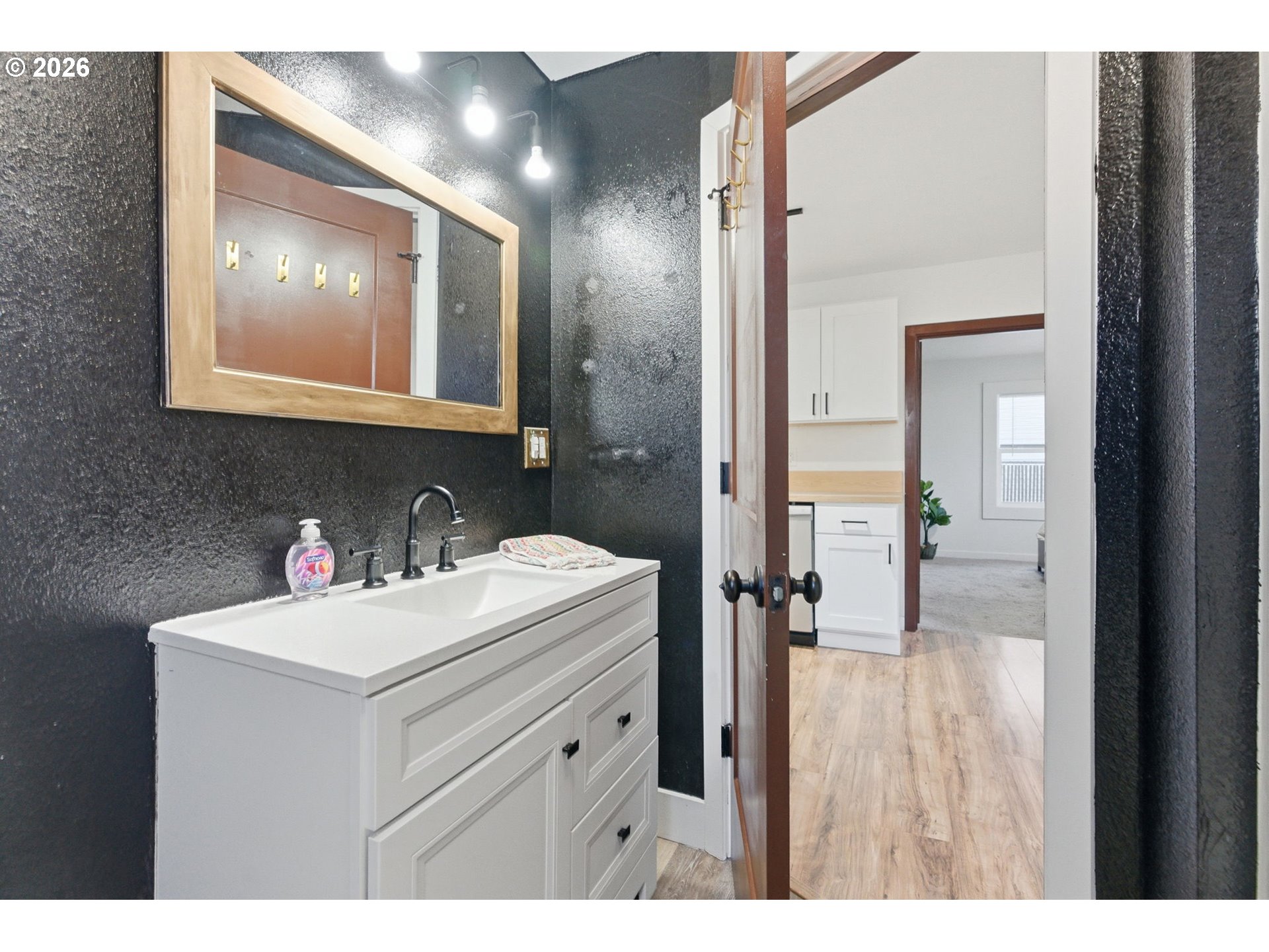 16484 Front Avenue Oregon City, OR 97045 - Photo 20 of 34 a bathroom with a sink mirror and vanity