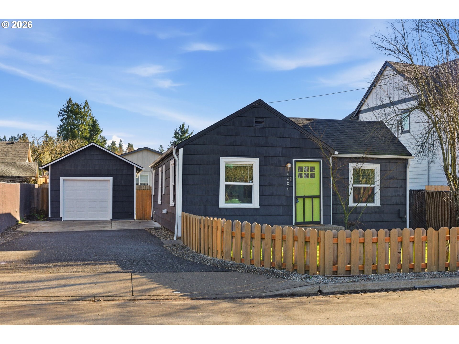 16484 Front Avenue Oregon City, OR 97045 - Photo 2 of 34 a front view of a house with a yard