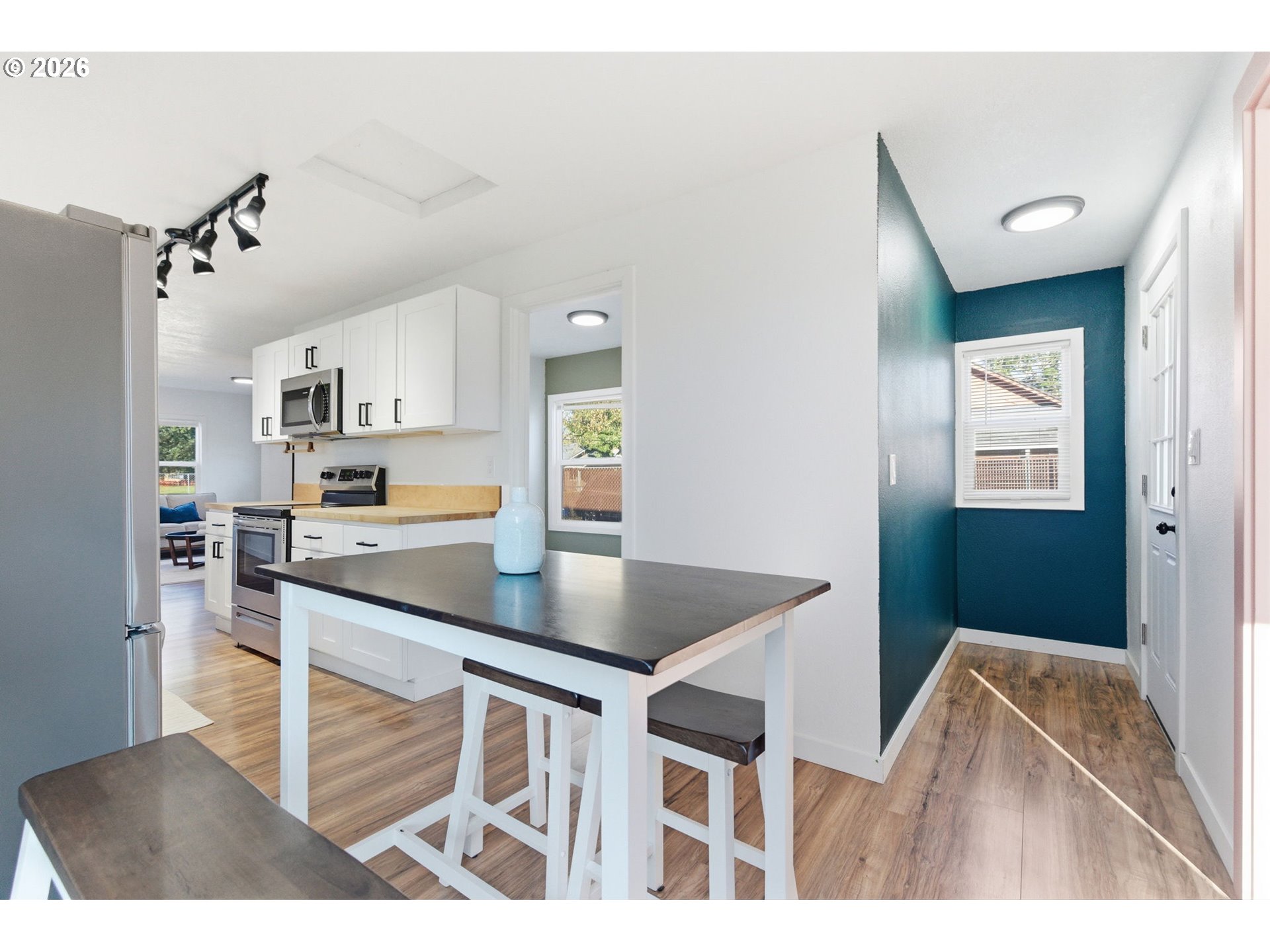 16484 Front Avenue Oregon City, OR 97045 - Photo 21 of 34 a kitchen with kitchen island a counter top space appliances and cabinets