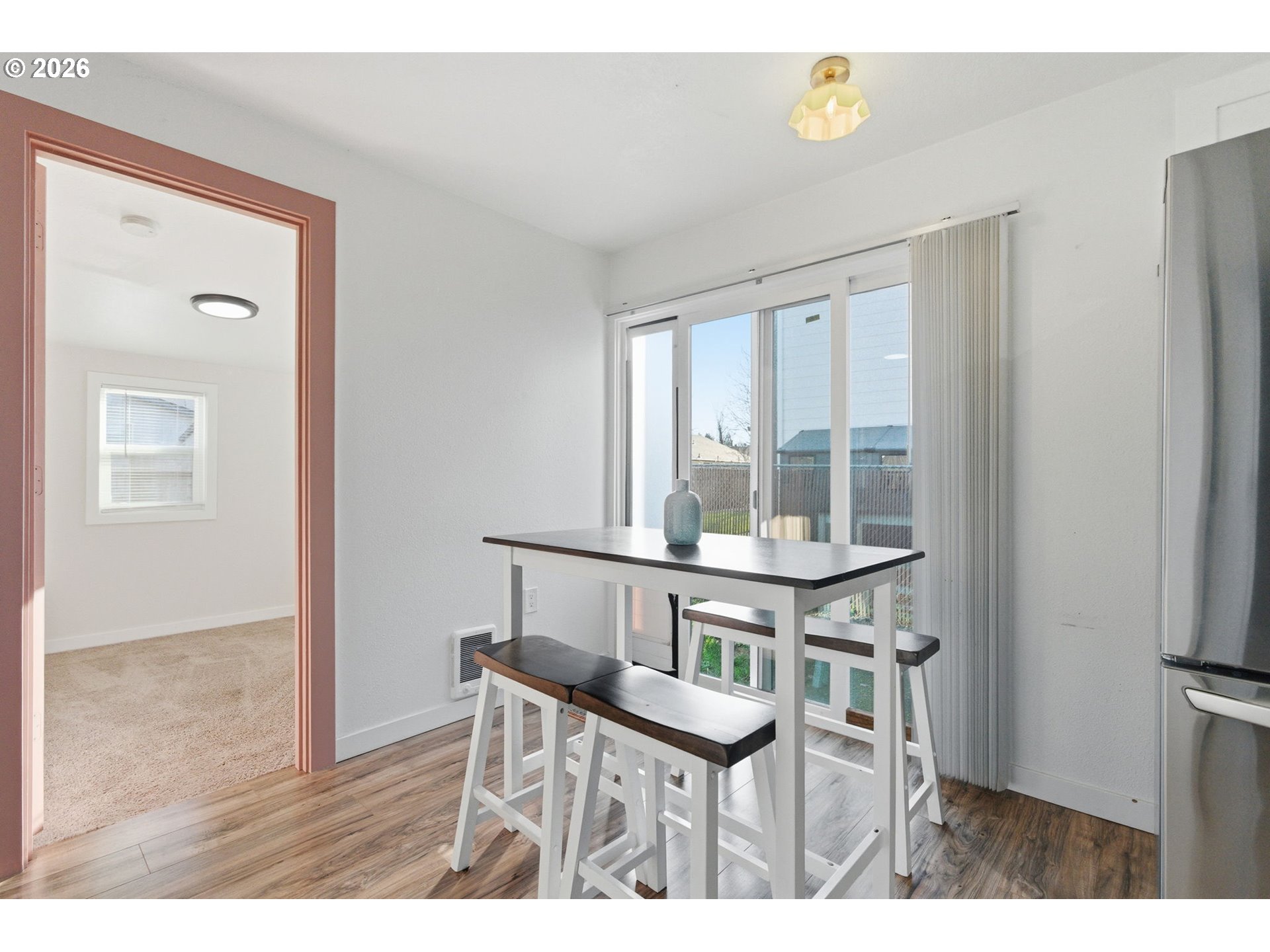 16484 Front Avenue Oregon City, OR 97045 - Photo 23 of 34 a view of a dining room with furniture and wooden floor