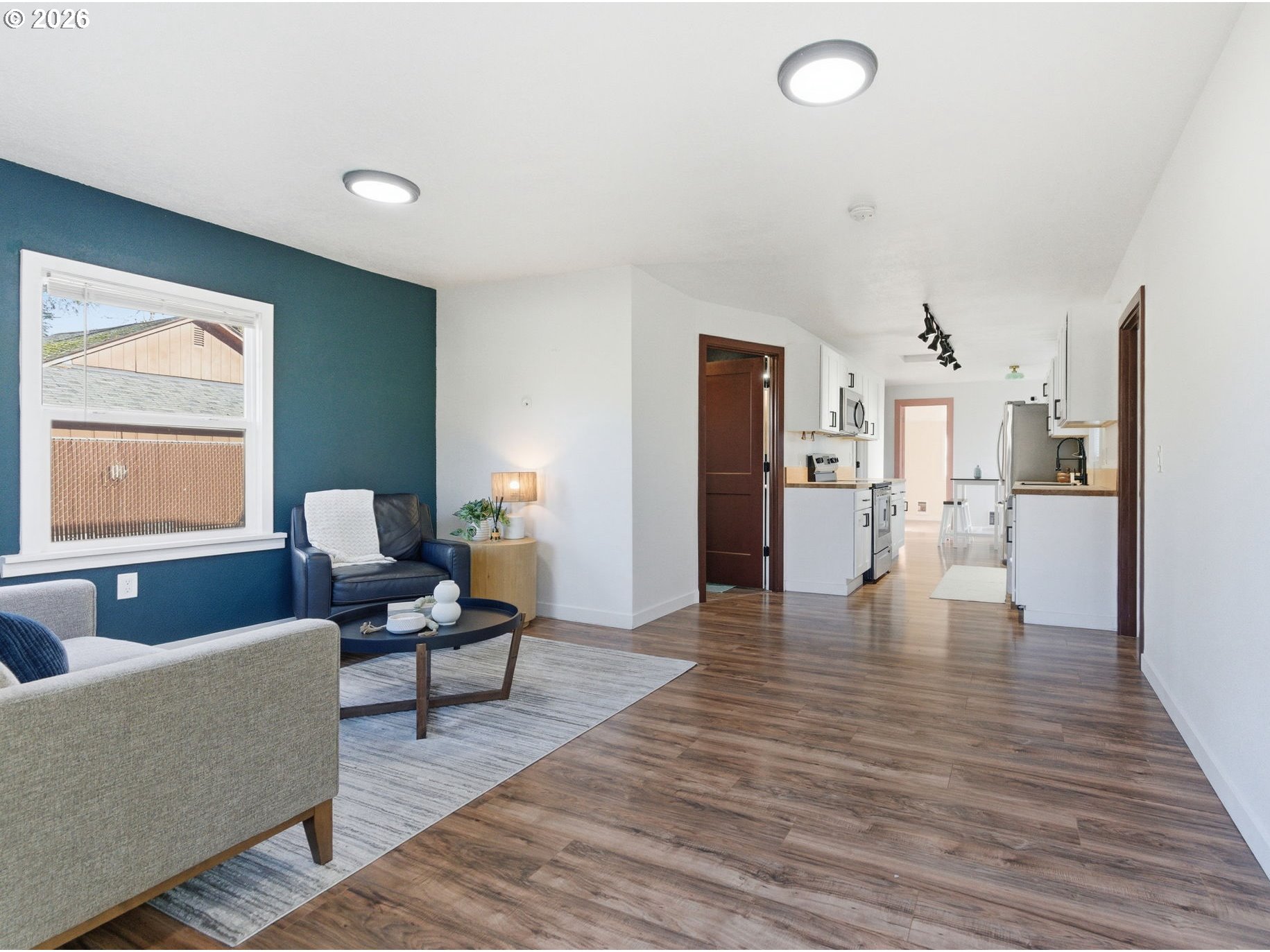 16484 Front Avenue Oregon City, OR 97045 - Photo 6 of 34 a living room with furniture and a wooden floor