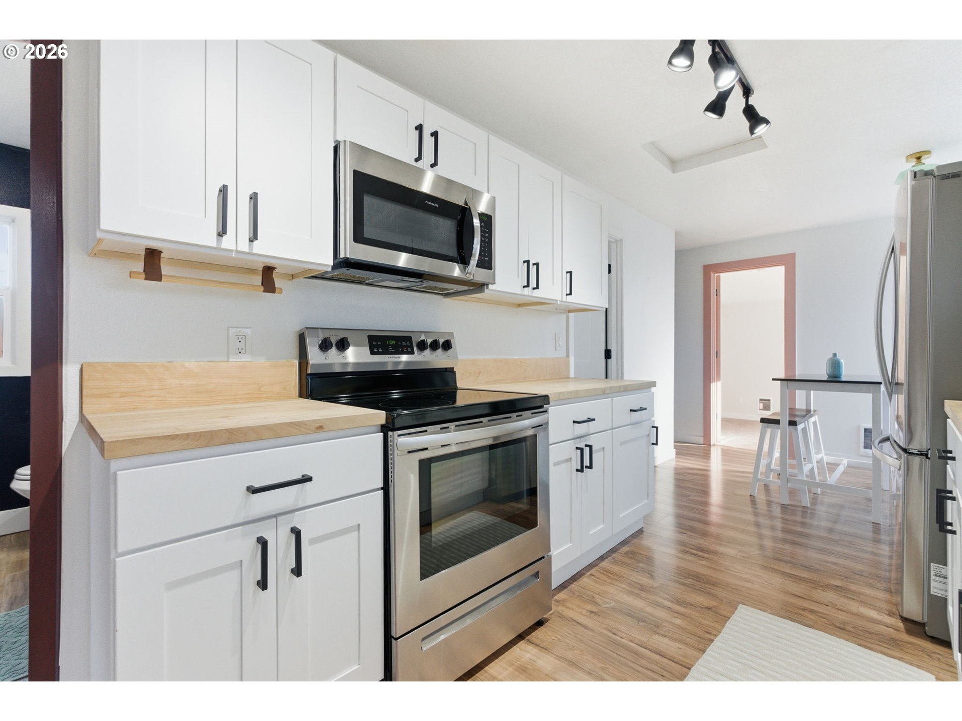 16484 Front Avenue Oregon City, OR 97045 - Photo 8 of 34 a kitchen with stainless steel appliances a stove microwave and a sink