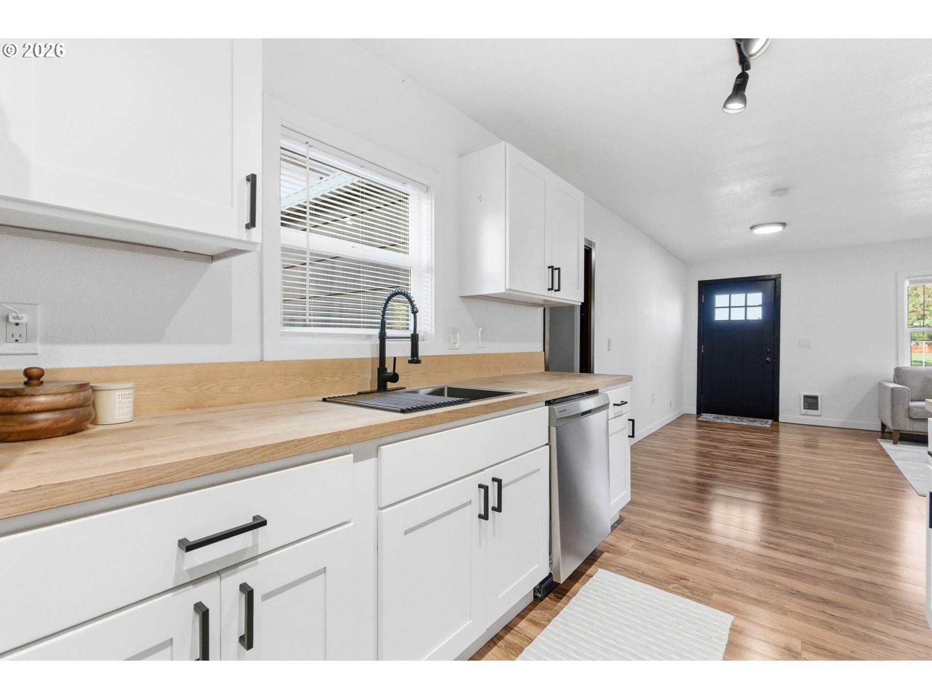 16484 Front Avenue Oregon City, OR 97045 - Photo 9 of 34 a kitchen with a sink cabinets and wooden floor