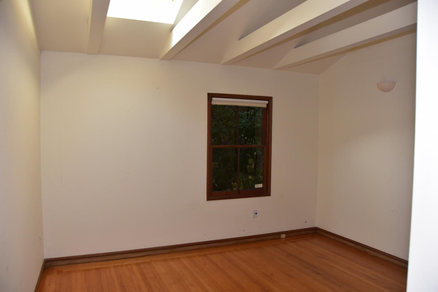 66 Poppy Lane Berkeley, CA 94708 - Photo 12 of 38 a view of an empty room with wooden floor and a window