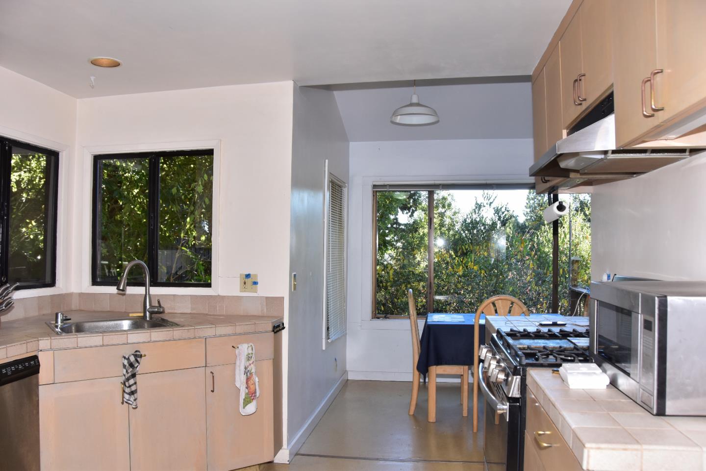 66 Poppy Lane Berkeley, CA 94708 - Photo 14 of 38 a kitchen with a sink and a large window