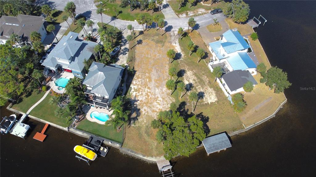 5452 Bellview Avenue New Port Richey, FL 34652 - Photo 1 of 3 an aerial view of a house with a yard and garden