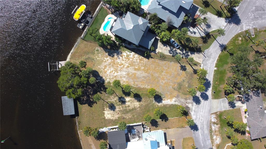 5452 Bellview Avenue New Port Richey, FL 34652 - Photo 2 of 3 an aerial view of a house with a yard and garden