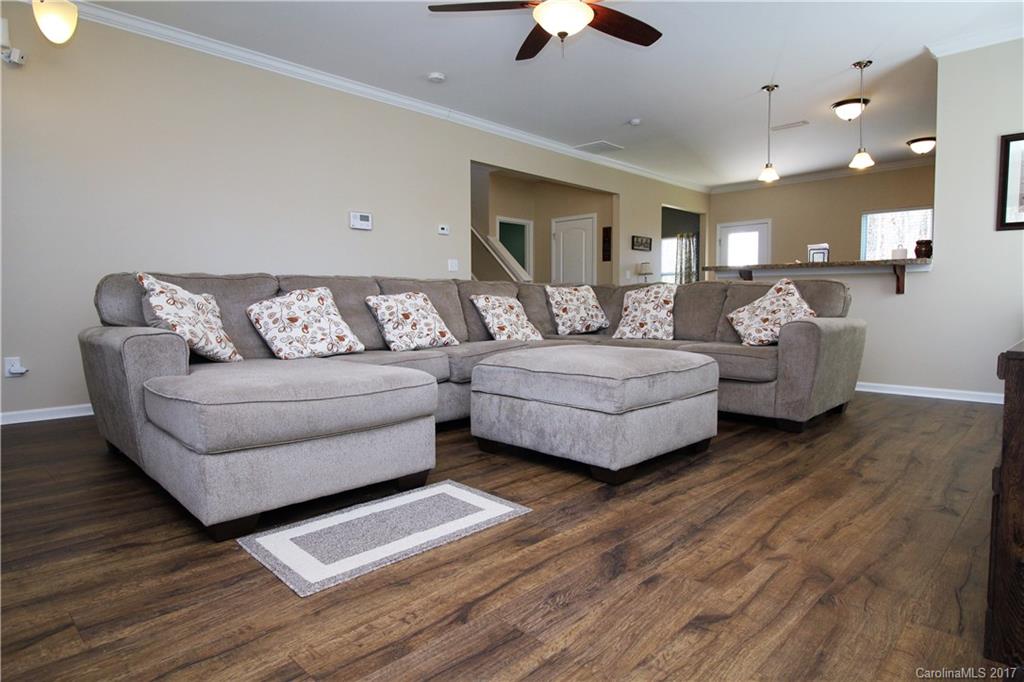 240 Mott Road Mooresville, NC 28115 - Photo 2 of 14 a living room with furniture and a wooden floor