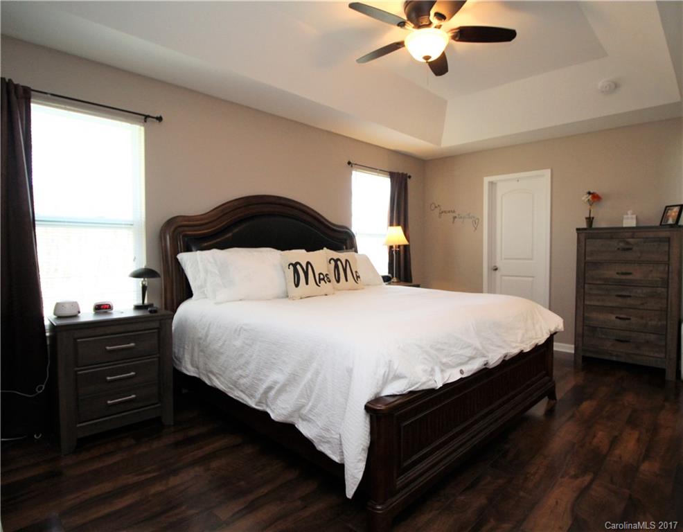 240 Mott Road Mooresville, NC 28115 - Photo 5 of 14 a bedroom with a bed and a dresser