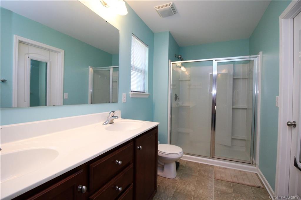240 Mott Road Mooresville, NC 28115 - Photo 6 of 14 a bathroom with a sink toilet and shower