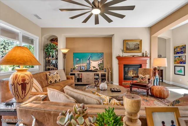 a living room with fireplace furniture and a fireplace