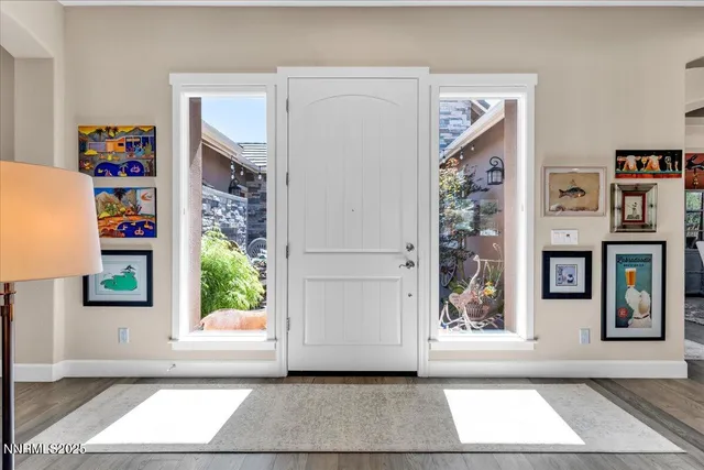 a view of entryway with window and refrigerator