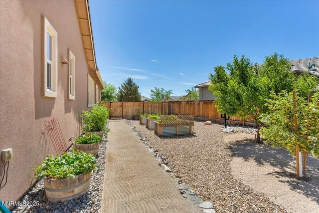 a view of a backyard with sitting area
