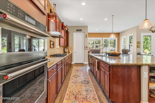 a kitchen with stainless steel appliances granite countertop counter space and a sink