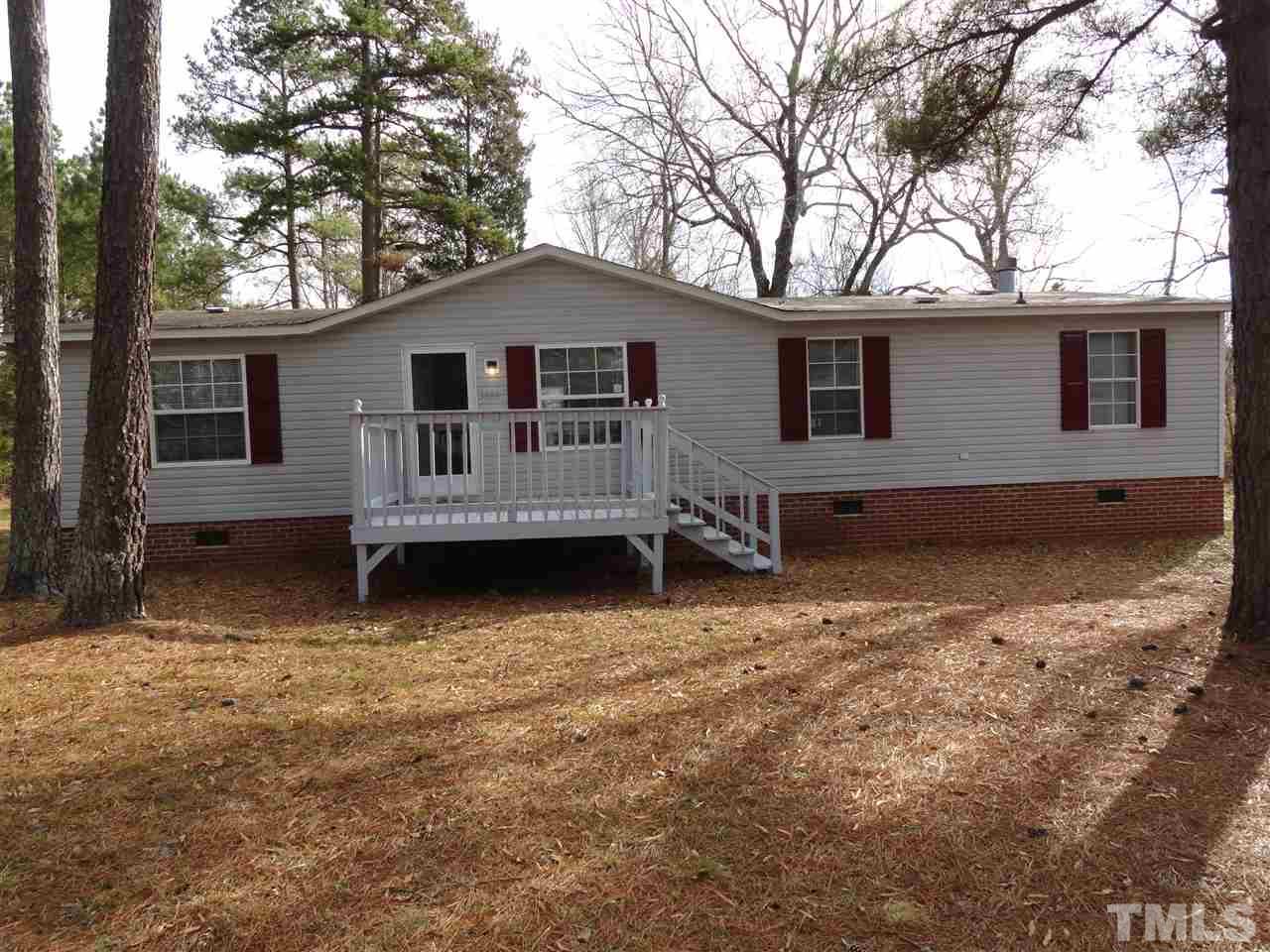 3388 Dirgie Mine Road Roxboro, NC 27574 - Photo 1 of 12 a front view of a house with yard